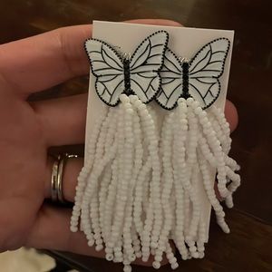 Like new butterfly earrings with flowing white beads